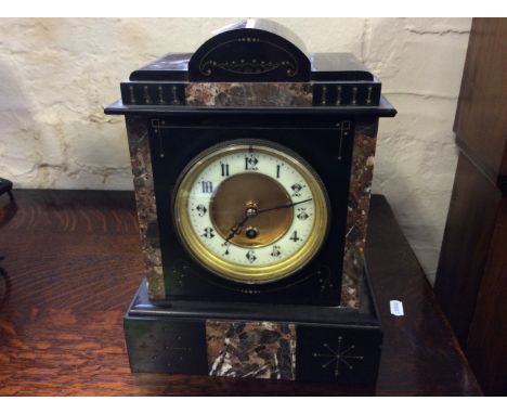 A French marble and slate mantle clock with with inlaid marble.
