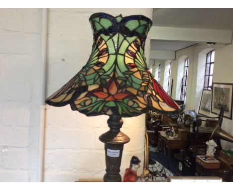 A Tiffany style lamp with floral decoration.
