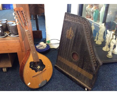 A Cremona mandolin with flower design and a Freya string instrument.