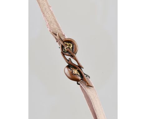 A COPPER OBIDOME (SASH CLIP) DEPICTING A POMEGRANATE BRANCHJapan, Tokyo, Meiji period (1868-1912)Worked in copper and gold de