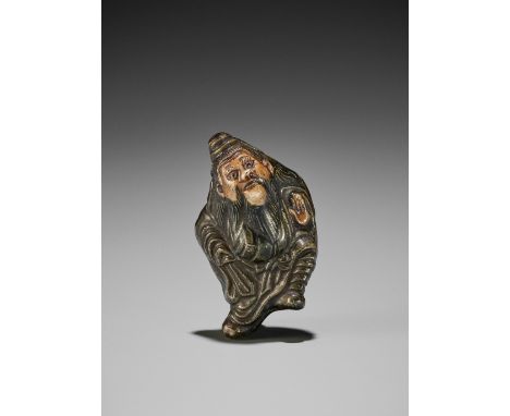 A GLAZED CERAMIC (YAKIMONO) NETSUKE OF SHOKIJapan, 19th centuryThe demon queller striding in a dynamic pose with the legs ben