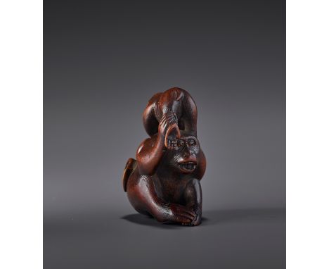 A FINE WOOD NETSUKE OF TWO MONKEYS AND PEACH SIGNED MASATSUGUSigned Masatsugu, Masatsugu 正次Japan, 19th century, Edo period (1