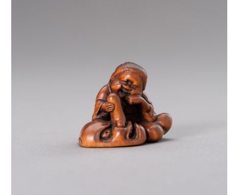 A BOXWOOD NETSUKE OF OKAME CARESSING A TENGU MASKJapan, 19th century, Edo period (1615-1868)The fine boxwood netsuke depictin