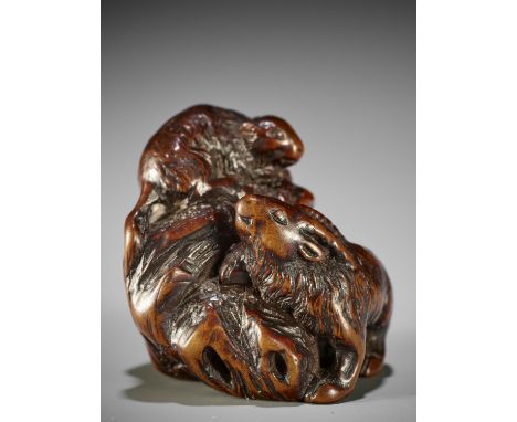 KOKEI: A RARE WOOD NETSUKE OF A GOAT AND YOUNG ON A ROCKBy Kokei, signed Kokei 虎溪Japan, Kuwana, Ise province, first half of 1