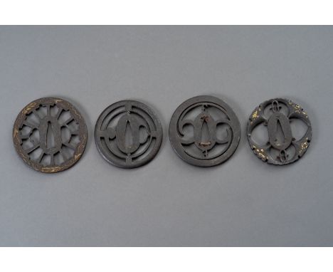 A GROUP OF FOUR IRON TSUBAJapan, Edo period (1615-1868) or earlier  The first a Heianjo tsuba of maru-gata form, carved in op