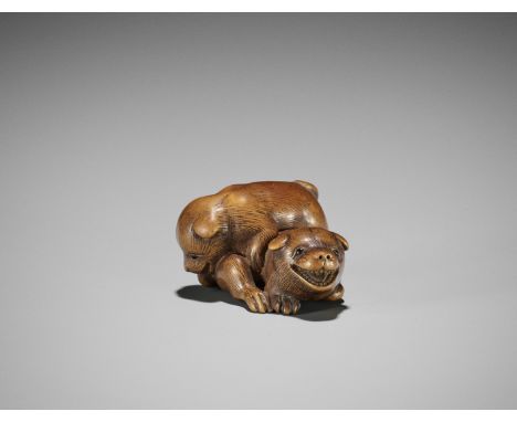 A CHARMING WOOD NETSUKE OF TWO PLAYFUL PUPSBy Ransen, signed RansenJapan, Kyoto, early 19th century, Edo period (1615-1868)Fi