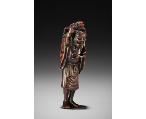 TADATOSHI: A LARGE WOOD NETSUKE OF GAMA SENNINBy Tadatoshi, signed Tadatoshi 忠利Japan, Nagoya, 19th century, Edo period (1615-