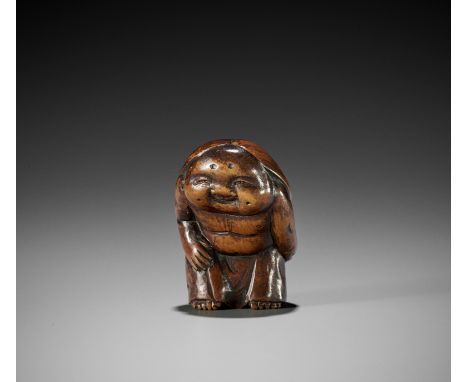 A LARGE WOOD SHUNGA NETSUKE OF OKAMEUnsigned Japan, late 18th to early 19th century, Edo period (1615-1868)Boldly carved stan