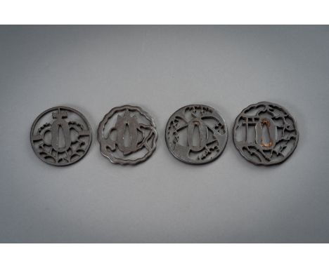 A GROUP OF FOUR IRON TSUBAJapan, Edo period (1615-1868)  The first a Higo sukashi tsuba of maru-gata form, carved in openwork