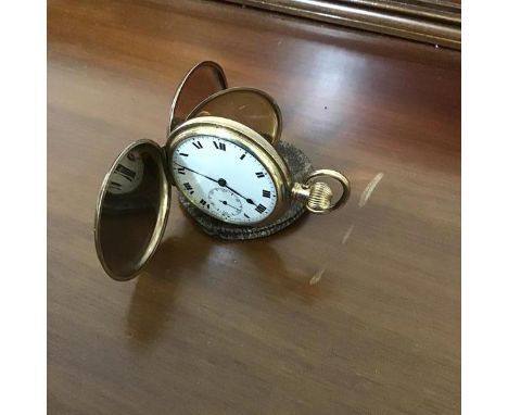A "Dennison American gold plated full hunter pocket watch, with white enamelled dial, roman numerals and seconds dial (tickin