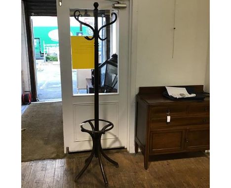 A mid 20thc bentwood hat and coat stand, with turned finial to top, with six bentwood hooks, with umbrella ring, on splay sup