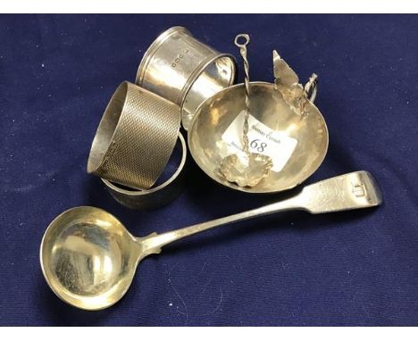 A mixed lot of silver including three hallmarked napkin rings, a small sauce bowl and matching spoon together with a silver s