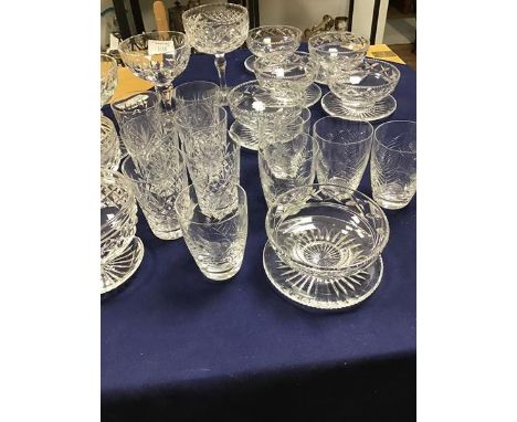 A mixed lot of crystal and cut glassware including a set of six cut glass grapefruit dishes, three cut glass jam dishes, a se