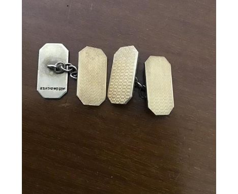 A pair of white metal gentleman's sleevelinks with gold plated engine turned fronts