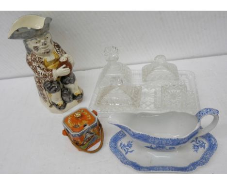 A large late 18th Century toby jug, blue and white gravy boat and dish, Japanese porcelain jam pot with wicker handle, togeth