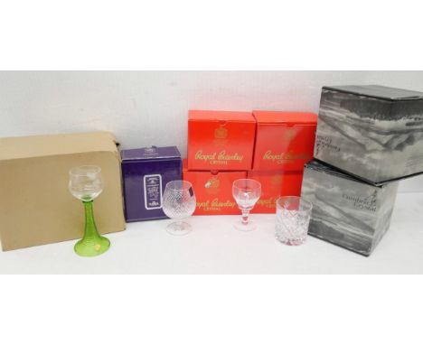 A collection of boxed crystal glass to include Royal Brierly crystal set of eight small wine glasses, Cumbria crystal set of 