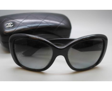 A pair of Prada sunglasses