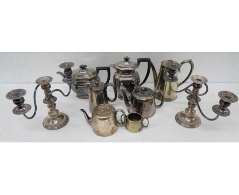 A collection of plated ware and a pair of silver on copper candlelabra