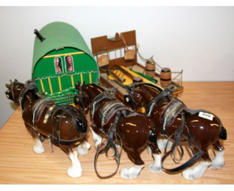 Three ceramic working horses with a dray cart and a gypsy wagon.