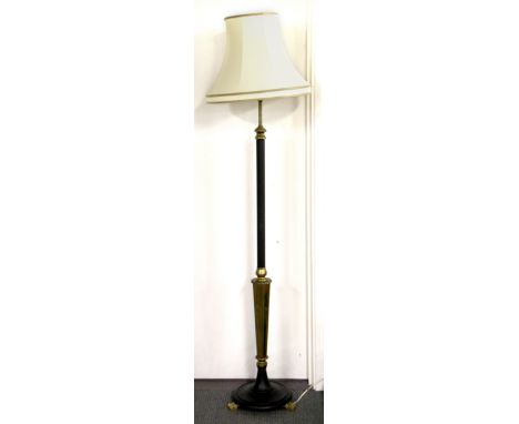 An impressive brass mounted standard lamp and silk shade.