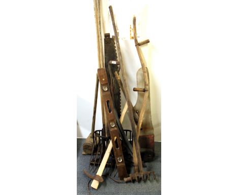 A quantity of vintage garden and farm tools.
