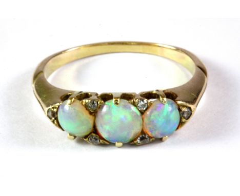 A yellow metal (tested minimum 9ct gold) opal and diamond set ring, (P.5).