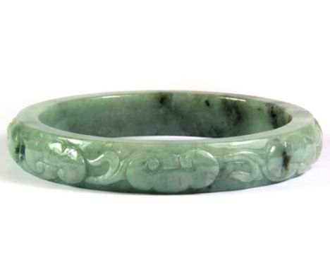 A superb Chinese carved jadeite jade bangle decorated with bats for luck, W. 1.5cm, internal Dia. 7.6cm.