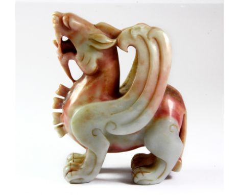 A superb 19th/ early 20th century Chinese mixed colour nephrite jade figure of a dragon, H. 10cm.