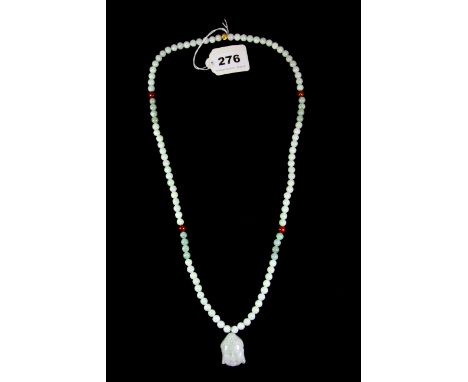 A Chinese mixed colour jade bead necklace with carved jade Buddha head pendant.