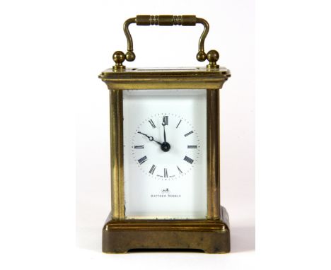 A small Matthew Norman brass carriage clock, H. 10cm.
