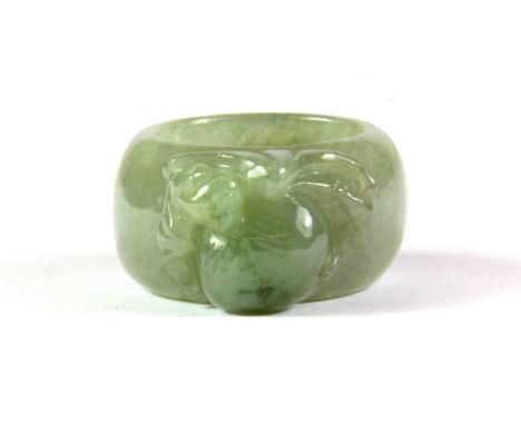 A finely carved jadeite jade ring, W. 1.5cm.