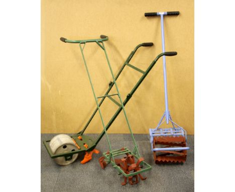 Three vintage small holding garden tools, roller and two rotavators.
