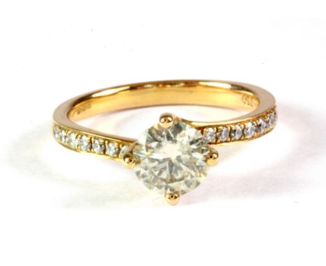 An 18ct yellow gold solitaire ring set with a brilliant cut diamond and diamond set shoulders, (approx. 1ct diamonds overall)