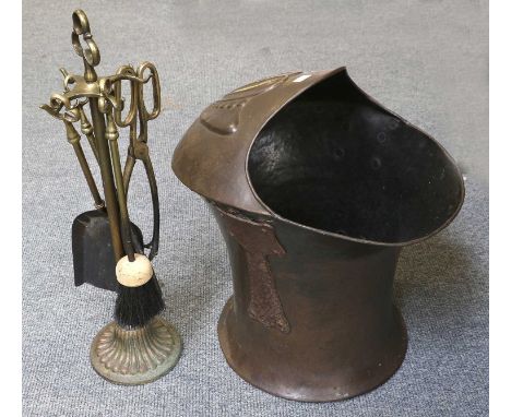 An Art Nouveau Helmet From Coak Skuttle, and associated fire tools 