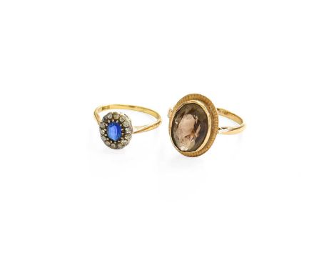 A 9 Carat Gold Smoky Quartz Ring, finger size R; and A Blue Glass and Diamond Cluster Ring, stamped '18CT', finger size L9 ca
