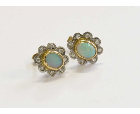 A Pair of Opal and Diamond Earrings, the oval cabochon opal in a yellow rubbed over setting, within a border of eight-cut dia