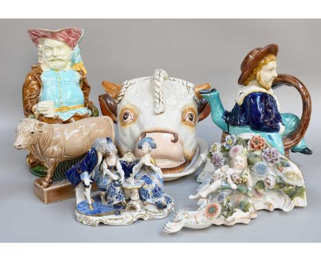 A Victorian Polychrome Toby Jug as a Seated Falstaff, 27cm high; together with a bull's head cheese dish and cover, a Wade "T