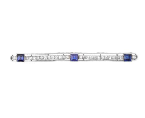 A Sapphire and Diamond Brooch, circa 1910, a row of old cut and eight-cut diamonds spaced by three square step cut sapphires,