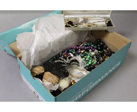 A shoebox of vintage costume jewellery