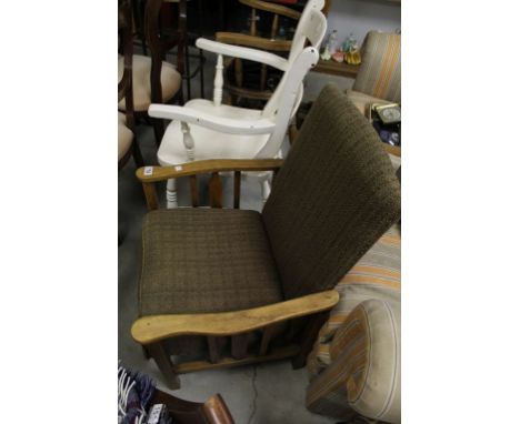 A vintage cottage reclining arm chair