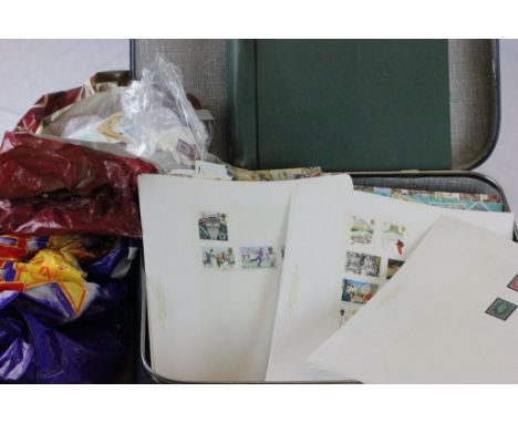 Suitcase of vintage stamps and old car tax discs etc