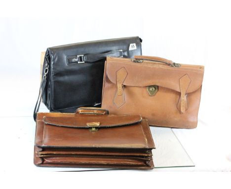 A vintage attache case and two others