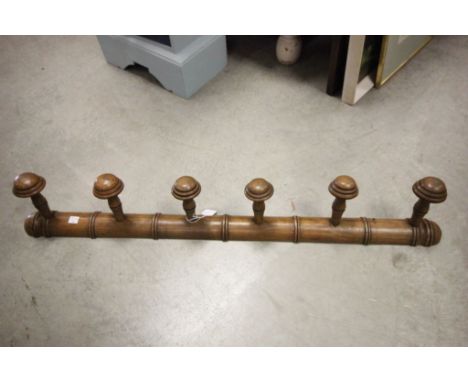 A vintage set of six faux bamboo coat hooks