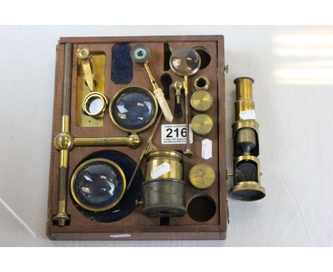 Collection of 19th century scientific instruments to include: condensing lenses, microscope and part mahogany case 
