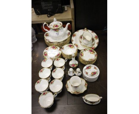 A large quantity of Royal Albert Country Roses china to include teapot, cups and saucers, plates ,coasters etc.
