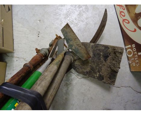 Collection of vintage tools to include hoes and a scythe