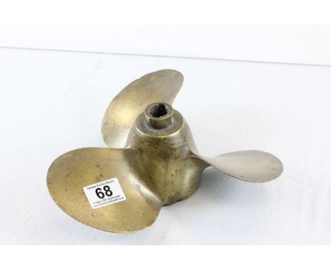 A vintage brass boat propeller