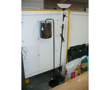 Two tubular black metal lamp standards.

*Please note that this lot is subject to VAT on top of the hammer at the prevailing 