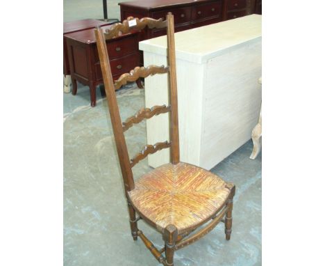 A Beech wood ladder back rush sated side chair.