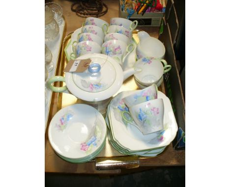 Shelley floral pattern tea service in pastel shades, including tea pot, 2 x sandwich plates, cream jug, side plates and cups 